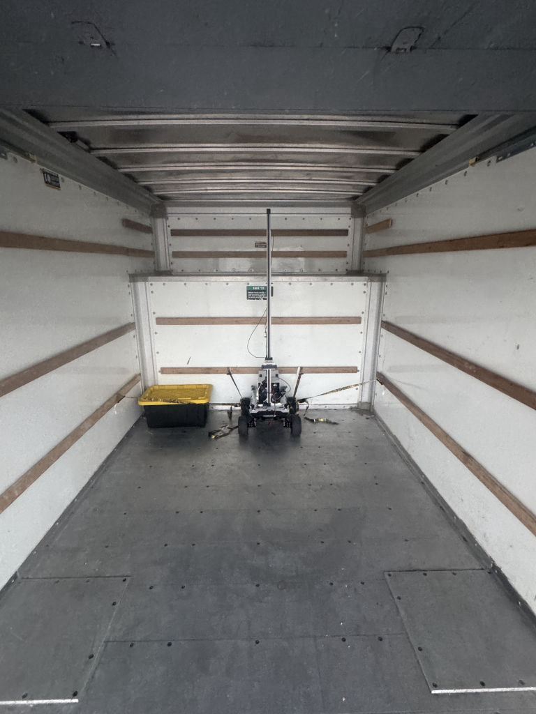 A scanner robot secured inside a moving truck on the way to a warehouse deployment